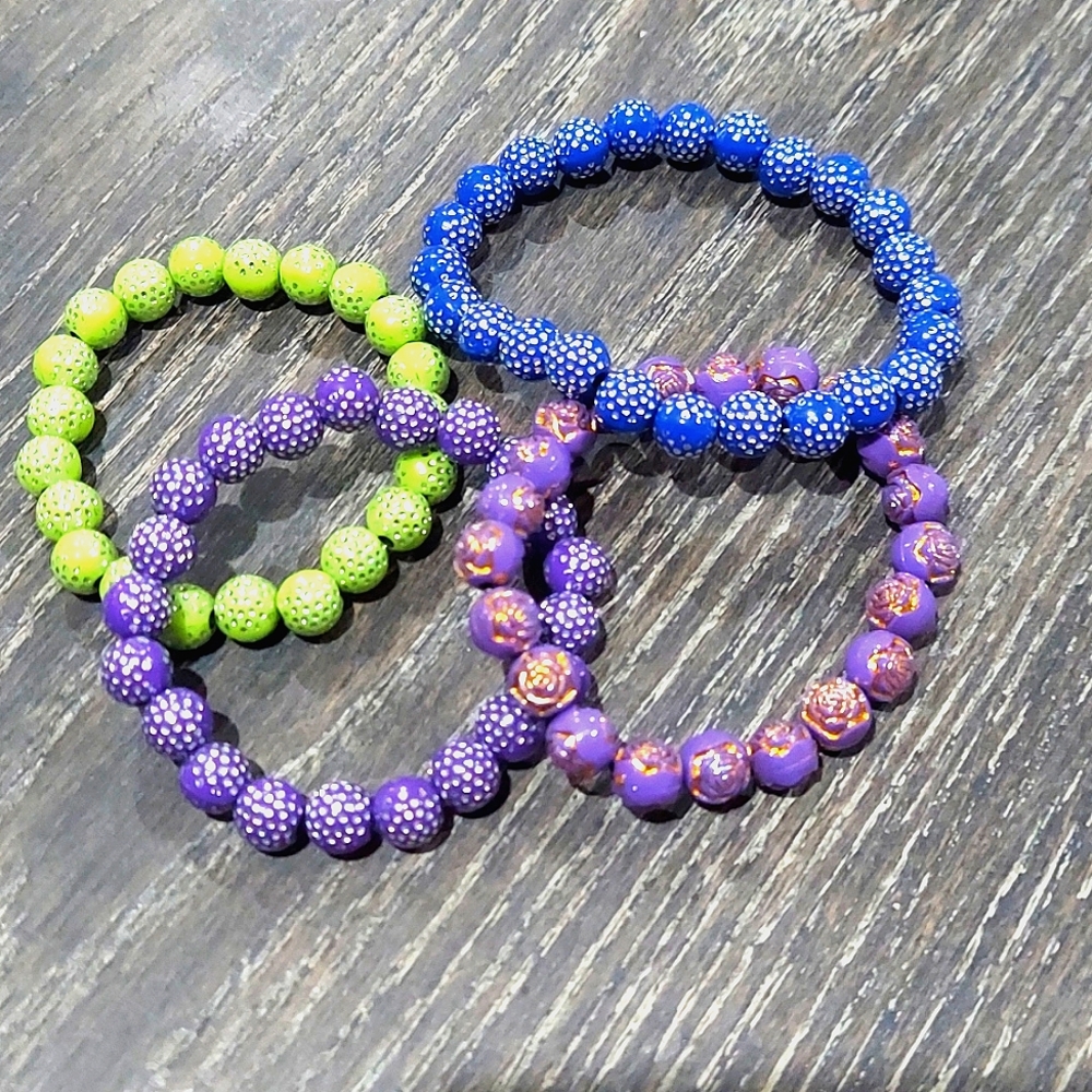 Kids jewlery  (4) piece set bracelets. Purple, gre